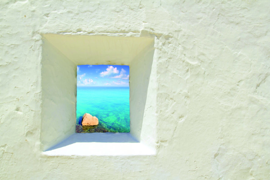 Ibiza mediterranean white wall window with Formentera beach view