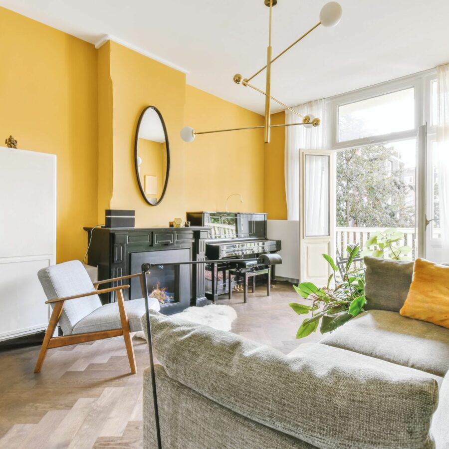 Spacious living room with a comfortable sofa and yellow walls